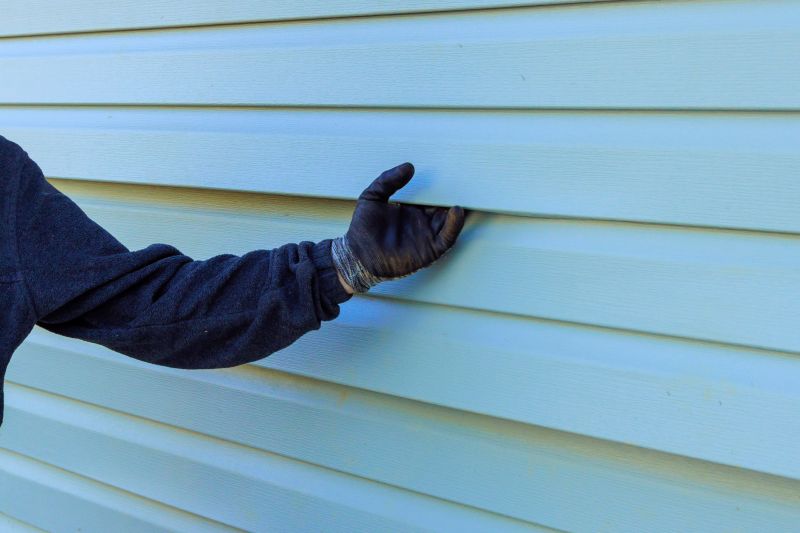 Inspecting Completed Vinyl Siding